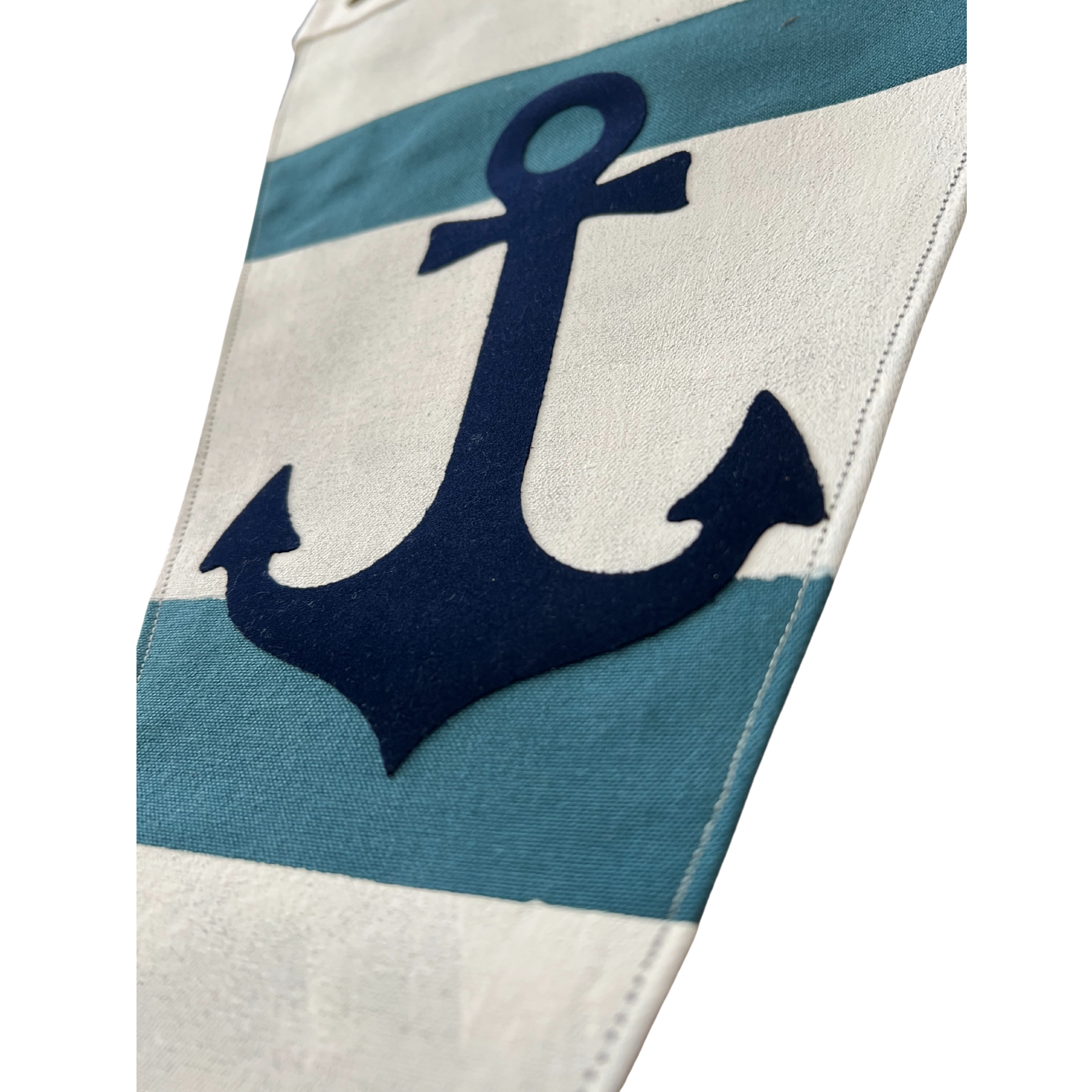 close up of Hand-crafted Nautical Anchor Flag featuring a bold anchor design on durable cotton canvas, perfect for coastal decor.